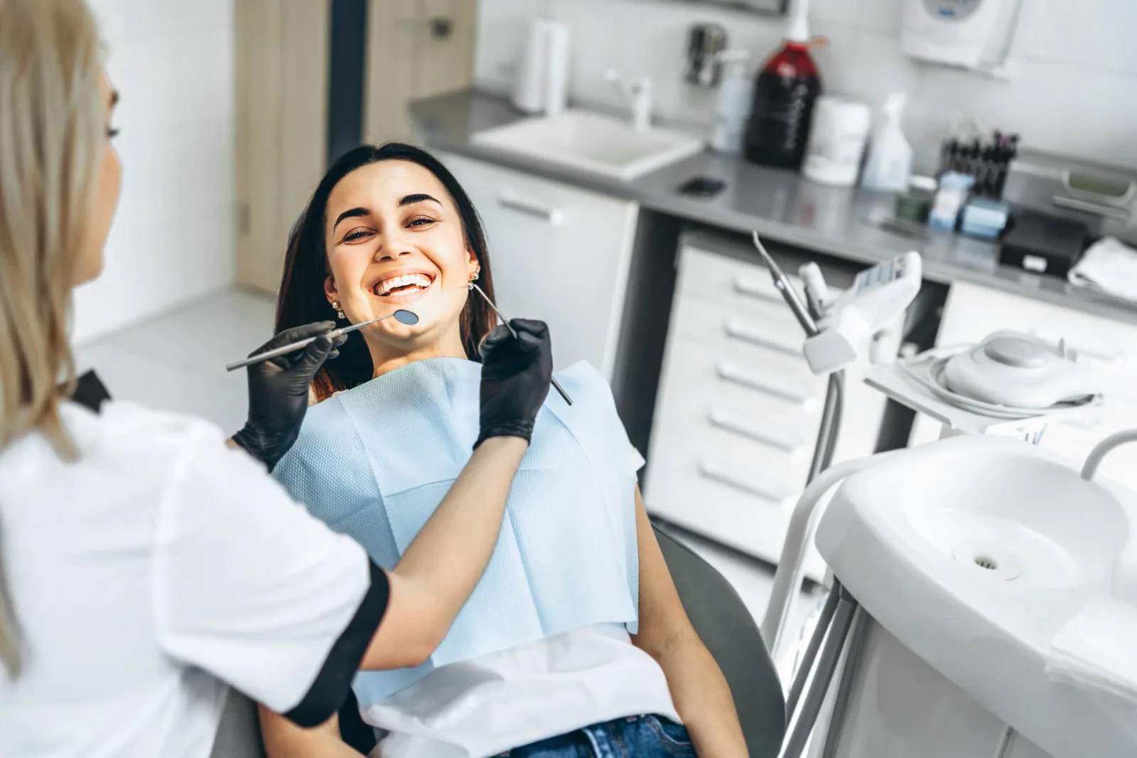 Clinician treating a patient in the Glassell Dental operatory